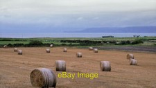 Photo 6x4 Farmland near Rattar Barrock Bales of hay (or straw?) in a fiel c2021