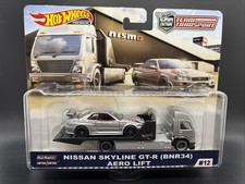Hot Wheels Premium Team Transport NISMO NISSAN SKYLINE GT-R (BNR34) y elevador aerodinámico