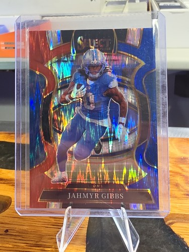 2025 Panini Select Red & Blue Shock Prizm Concourse Jahmyr Gibbs #71