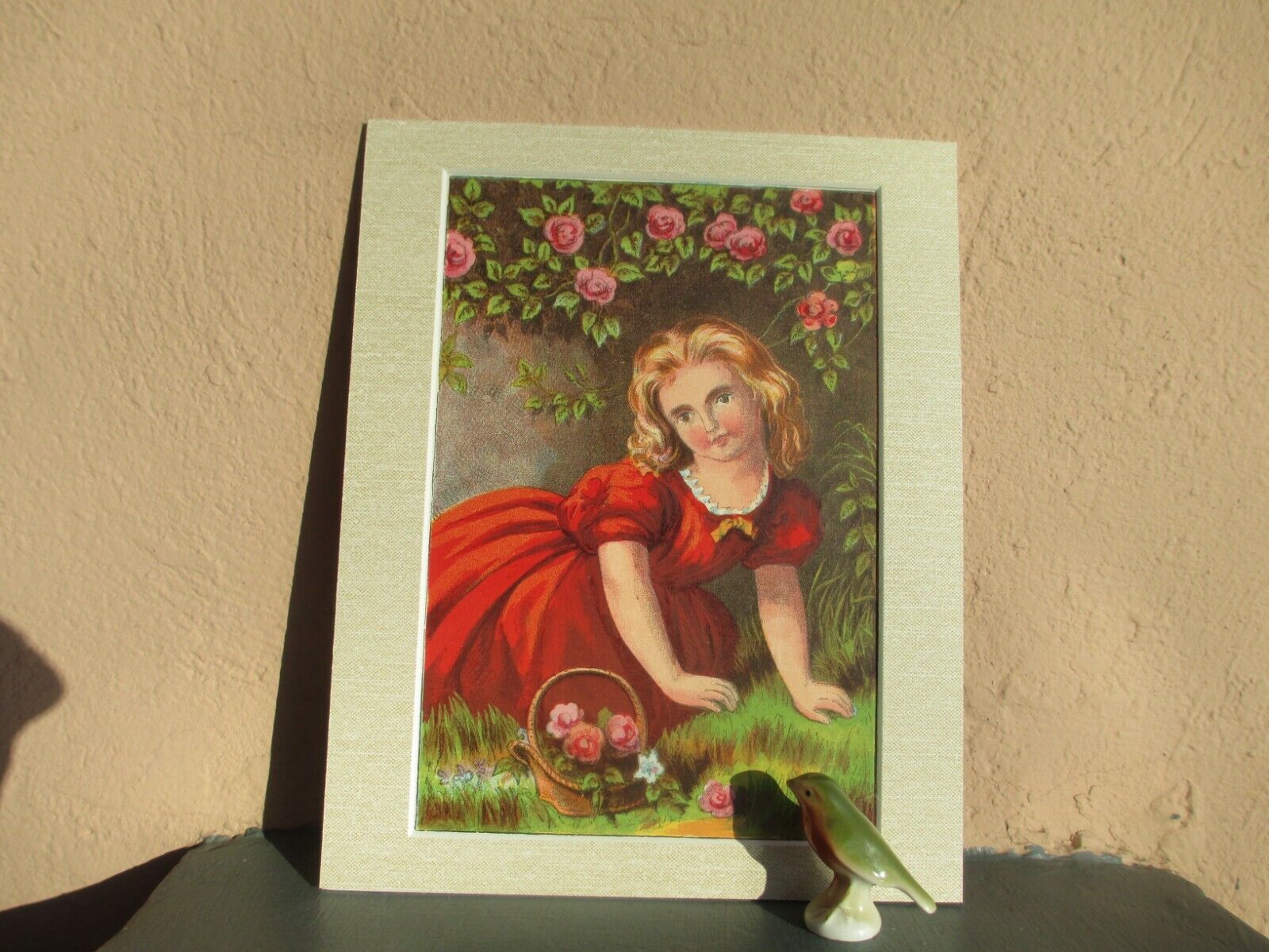 antique chromolithograph of girl and flowers 1880