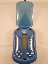 TETRIS FLIP-TOP LIGHTED SCREEN HANDHELD ELECTRONIC GAME BY RADICA 2006