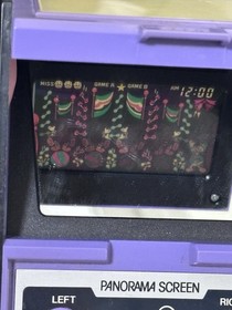 Original Game and Watch Disney Mickey Mouse handheld System.