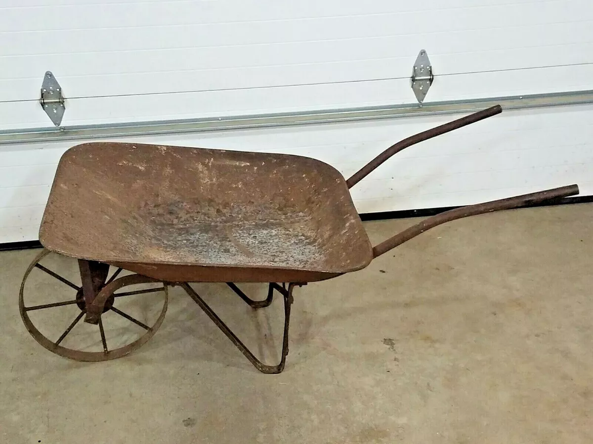 Antique wheelbarrow with metal wheel deals