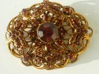 Alte Brosche mit roten Stein goldfarbig um 1950-Antik-Vintage-Modeschmusck?