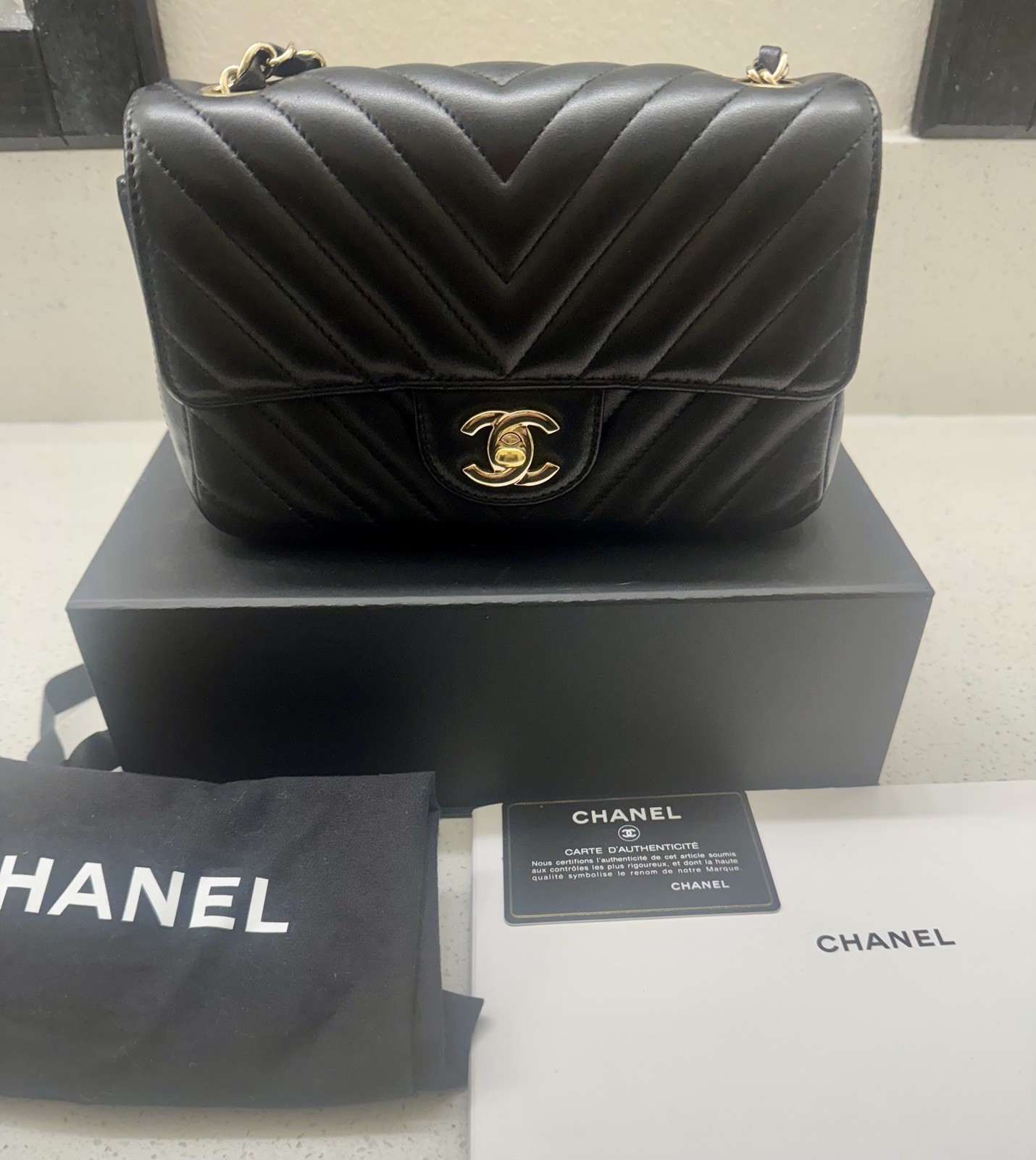 Auth Chanel Mini Rectangular Flap Bag Chevron Black Lambskin w/Gold Hardware