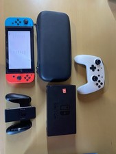 Nintendo Switch 32 Go Console Portable avec Manettes Joy-Con Bleu Néon/Rouge...