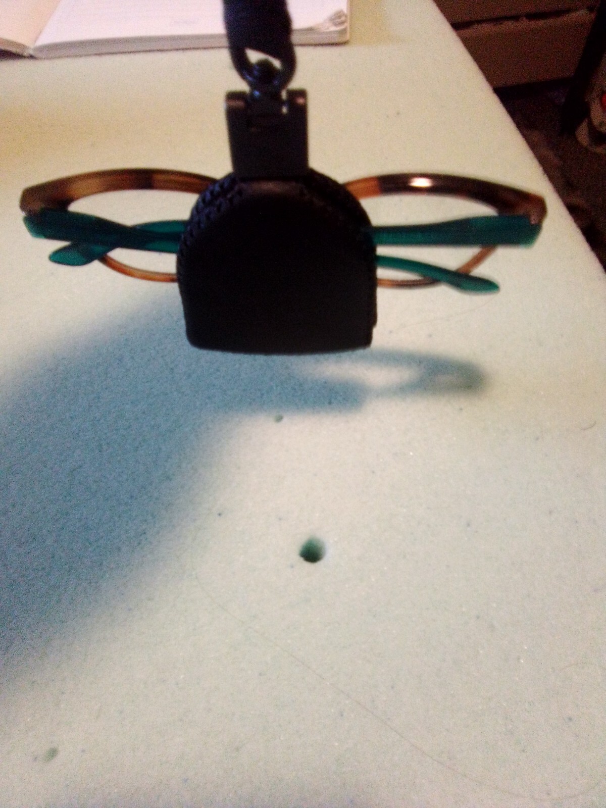 Black leather magnetic eyeglass holder with secure hook closure