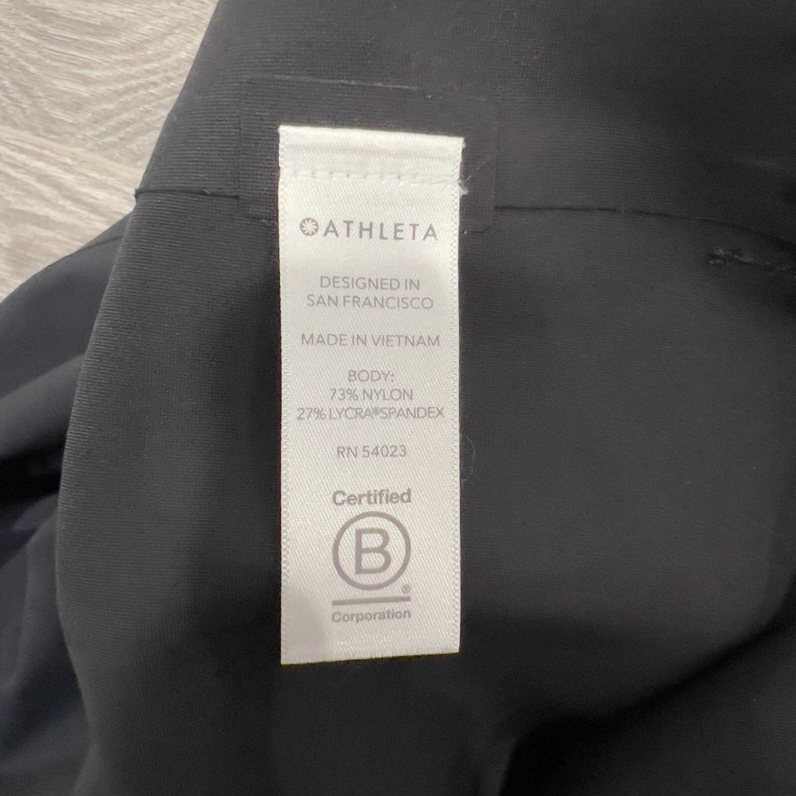 UNDERCOVER Athleta finto collo smanicato activewear mini abito donna taglia S nero zip laterale