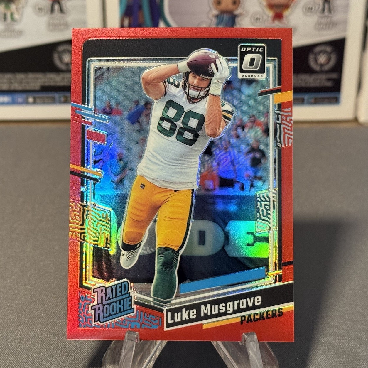 2023 Panini Donruss Optic Luke Musgrave Rated Rookie Card Red /99 Packers #241