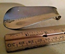 FREEMAN SHOE HORN IT'S A FREEMAN SHOE VINTAGE METAL CHROME FOOT HEEL SHOES.