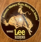 VINTAGE LEE RIDERS WESTERN PANTS 11 1/4" PORCELAIN METAL BLUE JEANS GAS OIL SIGN