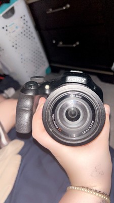 The camera is a Sony Cyber-shot DSC-HX100V Digital Camera (Black