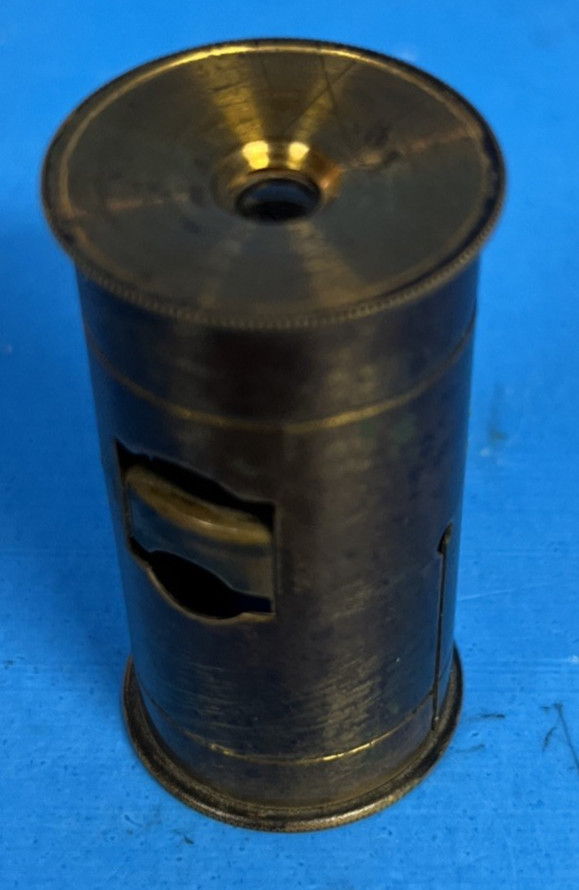 A gorgeous all-brass botanical dissection microscope viewer that looks straight out of a Victorian naturalist's field kit.