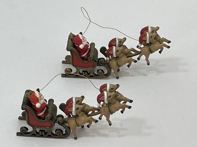 2 VTG Plastic Santa Sleighing Reindeers Take Flight Ornaments/Table Decor 4.5 