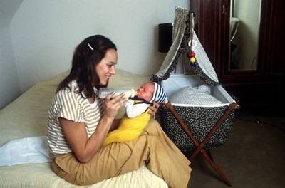 Former German track field athlete Heidi Schuller bottle feeds her - Old Photo