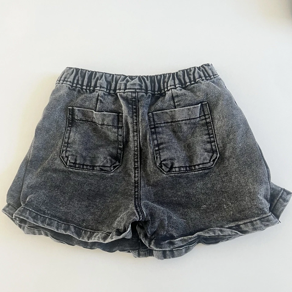 Falda vaquera plisada negra 6X Nicole Miller New York Foto 2 de 3