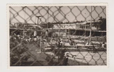 Through the Bars Snapshot of Shirtless Men by the Pool Unusual Abstract Photo
