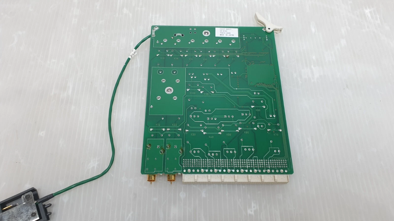 Back of the Agilent pin board with label, coax jacks and cable