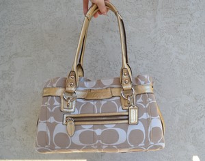 cream coach purse