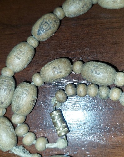 Handcrafted 42-Bead Wooden Japamala With Carved Swastika And Buddha Symbols..