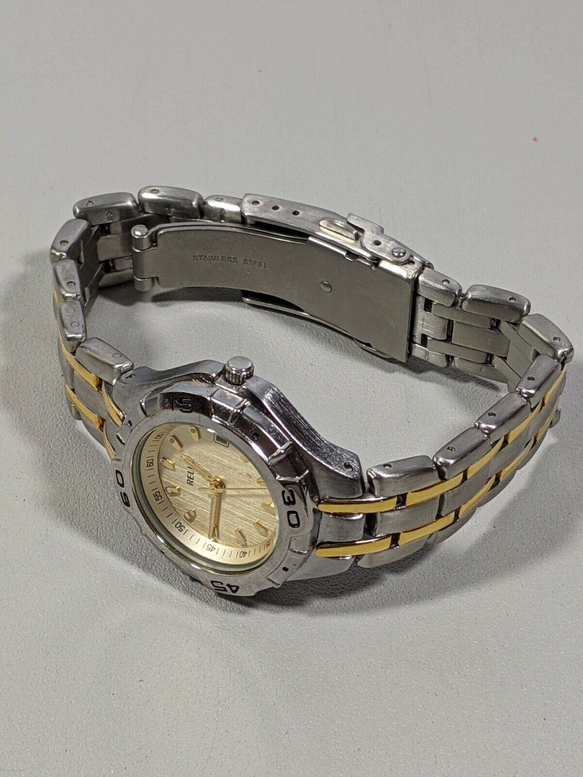 Relic Silver Tone Gold Tone Rotating Bezel Date Indicator Stainless Steel Watch 