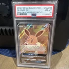 The Pokémon Company Pokémon TCG Eevee GX SM233 SM Black Star Promo Holo PSA 8