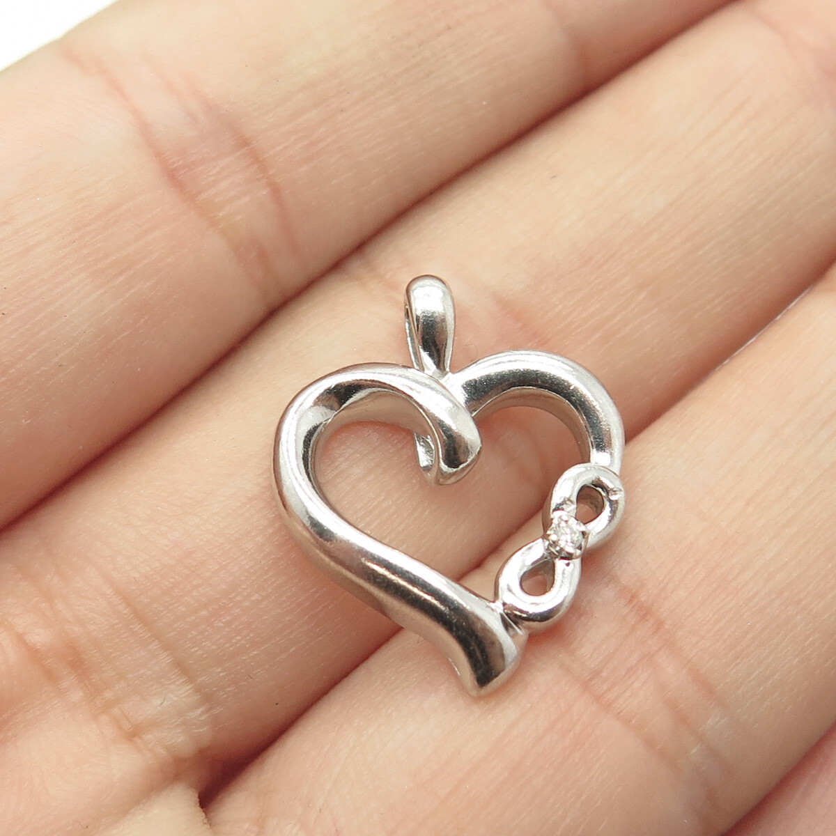 Diamond Heart Twinkle Pendant .03 CTW Rhodium on Sterling Silver Diamond Heart Twinkle Pendant .03 CTW Rhodium on Sterling Silver