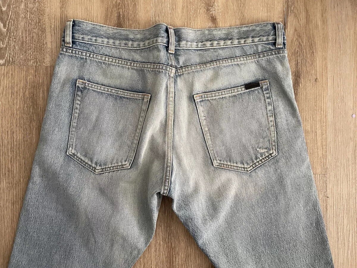 Jeans uomo Saint Laurent slim strappato al ginocchio blu. Taglia 32