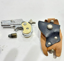 2497.25 Vintage Nichols 3.25" DM Hide A Mite Cap gun W/Holster, Gun Bullet