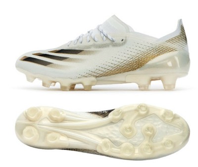 white cleats with gold bottom