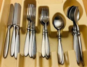 Cambridge Stainless Flatware 16 pc Set in the “Townhouse” pattern.