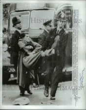 1961 Press Photo Policeman carry away a demonstrator in anti-nuclear rally.