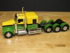 DCP First Gear Yellow & Green Kenworth W900L Tri Axle with 60" Flattop Sleeper