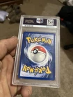 Pokemon TCG: Lt. Surge's Pikachu 081/132 Gym Heroes 1st Edition PSA 9