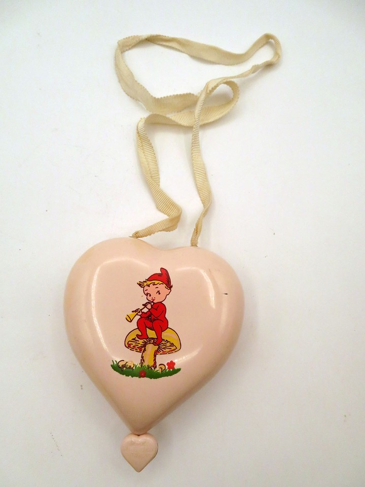 A Swiss Reuge pull-string elf-on-mushroom music box for children — whimsical, Swiss-made, and genuinely rare; this is the kind of vintage toy that makes grown adults gasp.