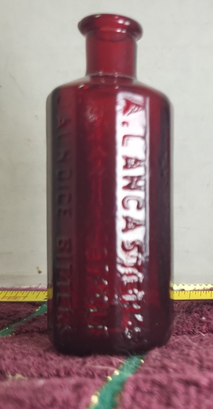 Reproduction Brown Medicine Bottle Lancaster's Bitters Wheaton Glass Co. 3" h.,
