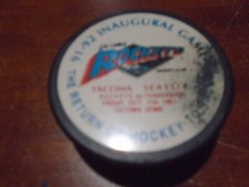 Game Used Hockey Puck from Tacoma Rockets Inaugural Game 10/11/91. EX.