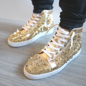 gold louboutin sneakers