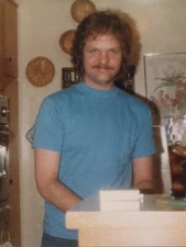 Candid Portrait Handsome Man Smiling in Kitchen with Cooking Utensils 1980s