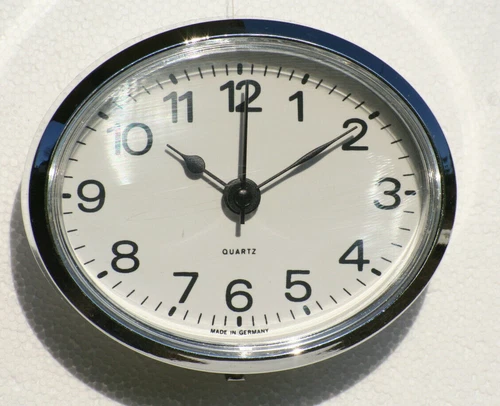 Oval Clock Suitable for Caravans, Motorhomes & Boats White Arabic, Silver Bezel