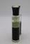 Clear glass Creed Aventus bottle with black textured middle section, black cap, and light yellow liquid.