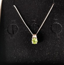 Silver necklace with peridot green stone pendant