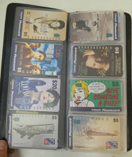 VINTAGE 90'S & 2000'S PHONE CARDS IN FOLDER BOOK- MISC LOT Y2K COLLECTABLE CARDS
