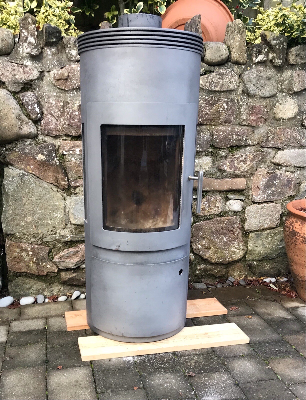 Westfire’ Danish wood burning stove, modern round design with side