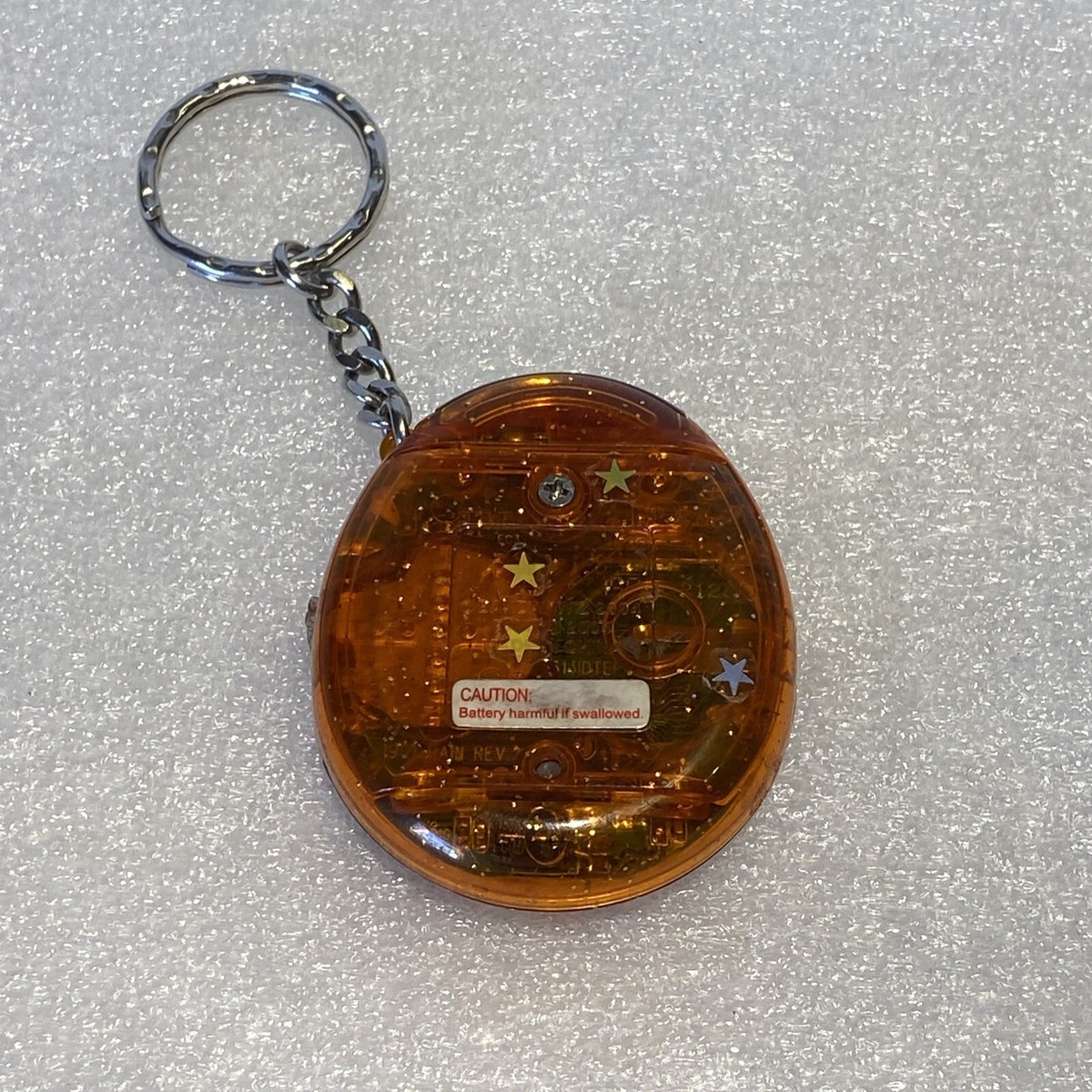 tamagotchi connection V1 orange clear/transparent with sparkles