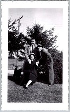 Vtg B&W Snapshot Group Outdoors With Evergreens 1950s
