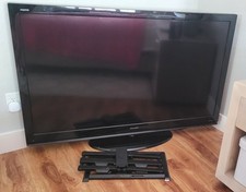 Sharp Aquos 60" LC-60E69U LCD HDTV with stand, remote and wall mounting system