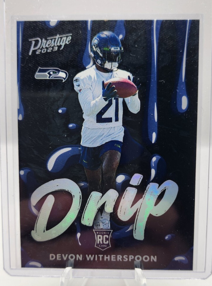 2023 Panini Prestige Football NFL Drip Insert of Rookie Devon Witherspoon!! SSP!