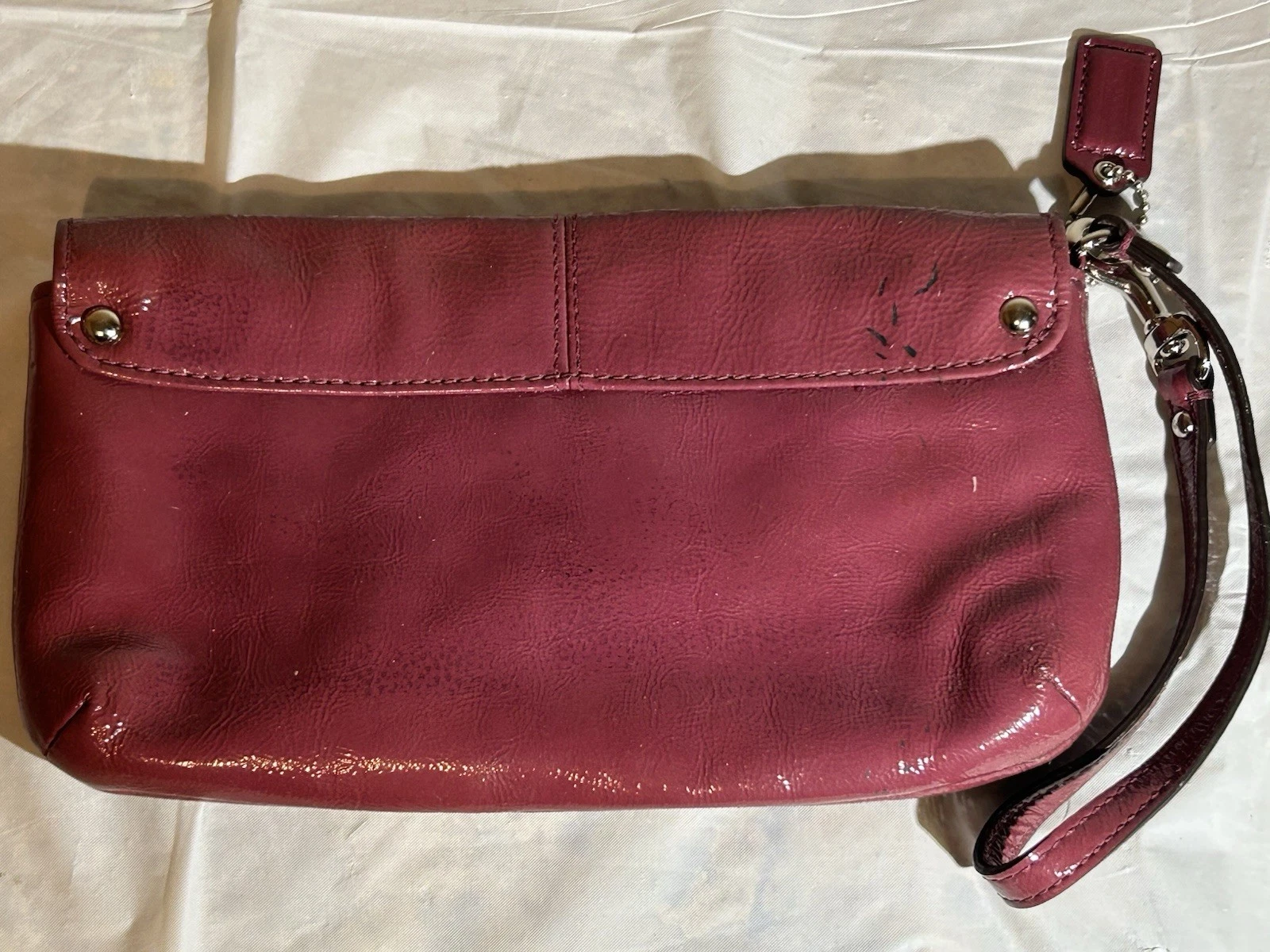 Borsa pochette da polso Coach prugna in pelle color bordeaux