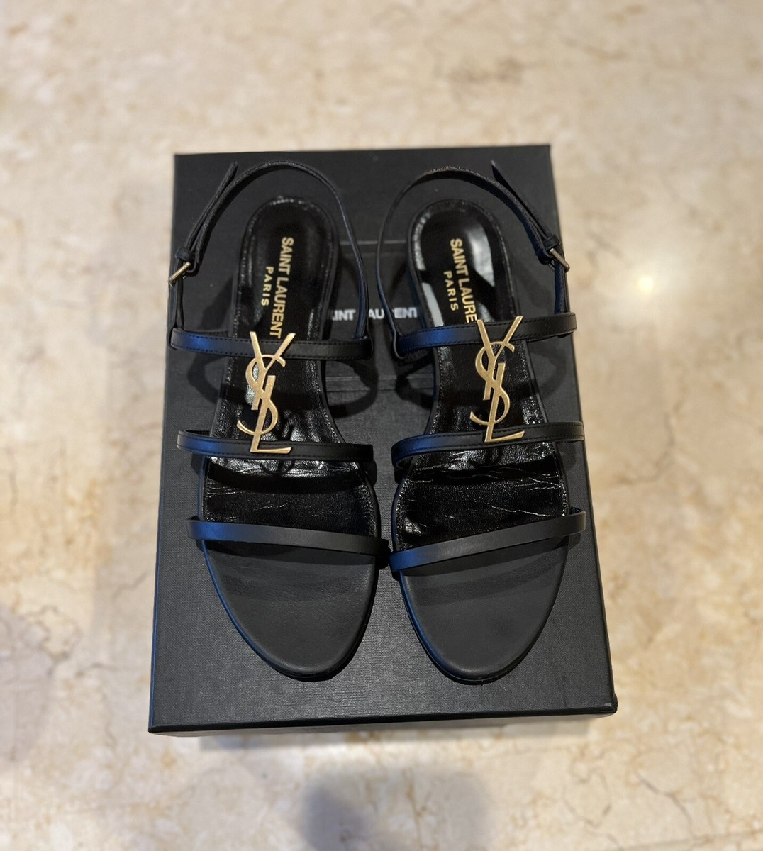【Saint Laurent】Cassandra Flat Sandals Black Saint Laurent Cassandra Leather Flat Sandals in Nero | FWRD